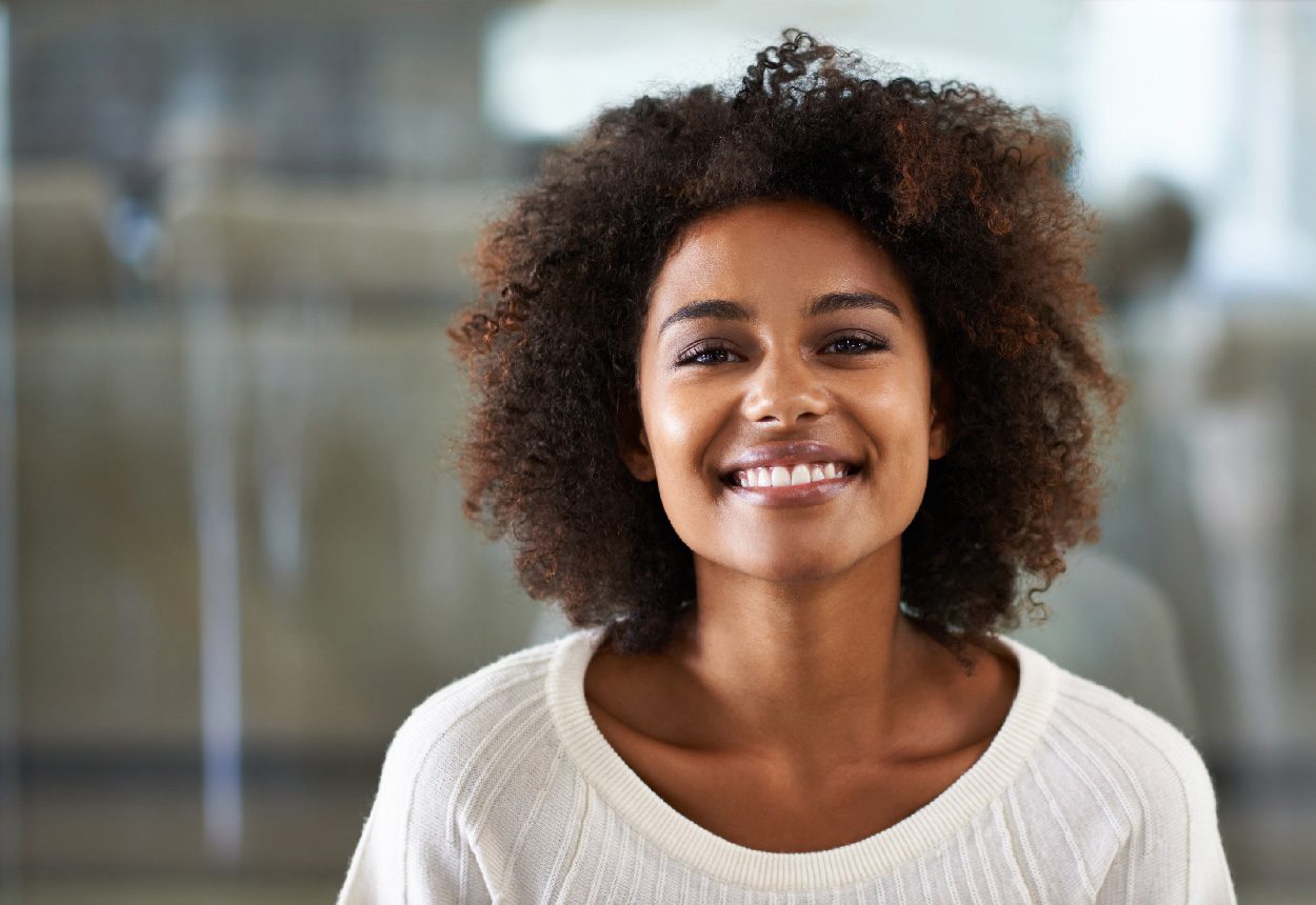Portrait of a smiling young woman at home.